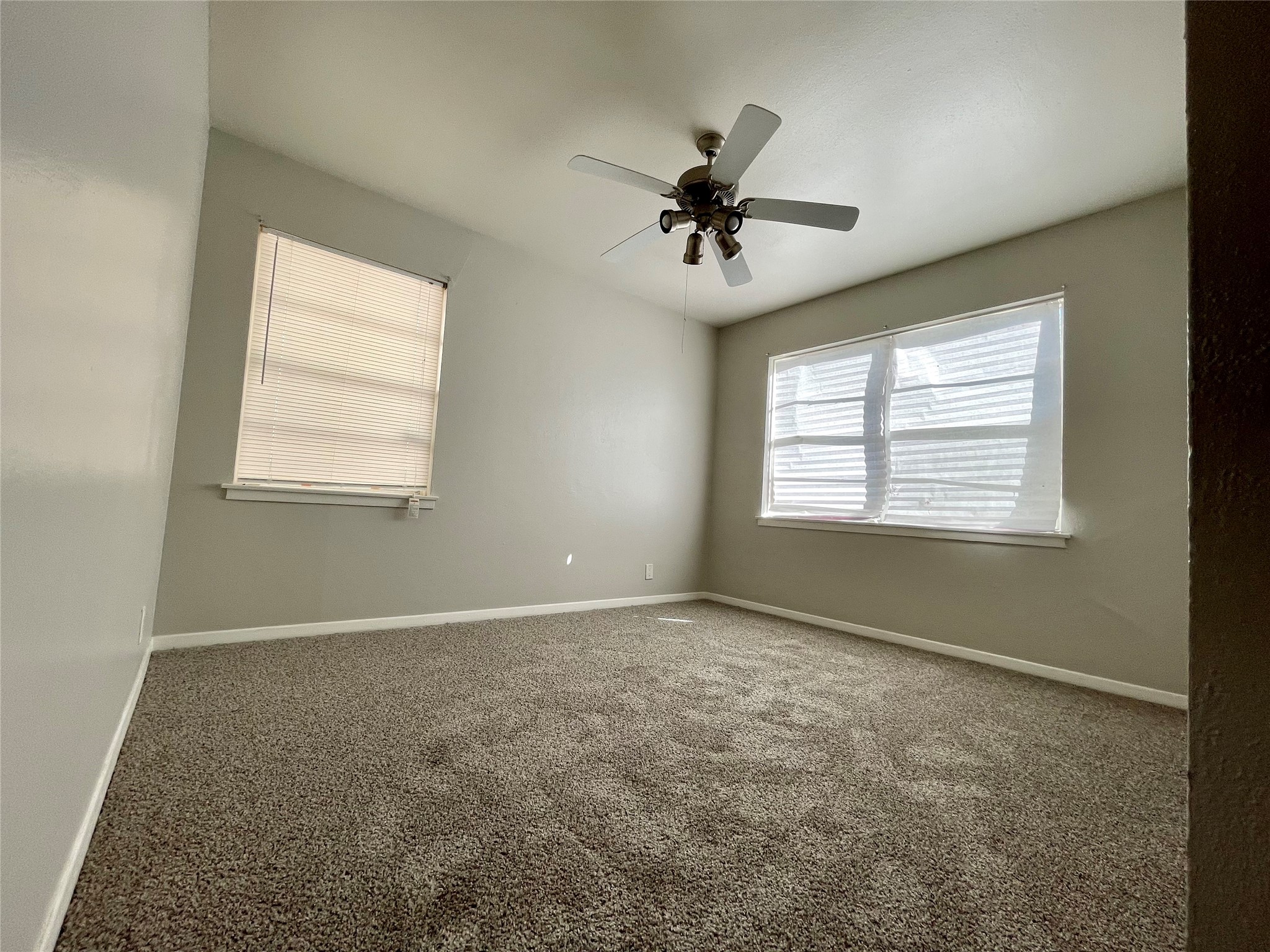 5406 Carew Street Houston, TX 77096 - Photo 8 of 18 a view of an empty room with a window
