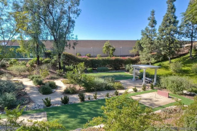 an aerial view of a house with yard basket ball court and outdoor seating