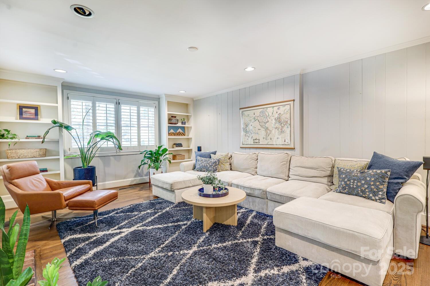 500 Ellsworth Road Charlotte, NC 28211 - Photo 11 of 40 a living room with furniture a table and a large window