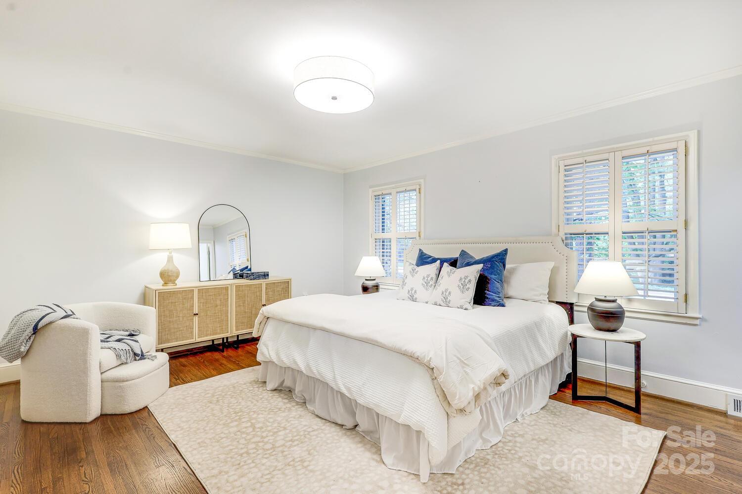 500 Ellsworth Road Charlotte, NC 28211 - Photo 19 of 40 a bedroom with furniture and wooden floor