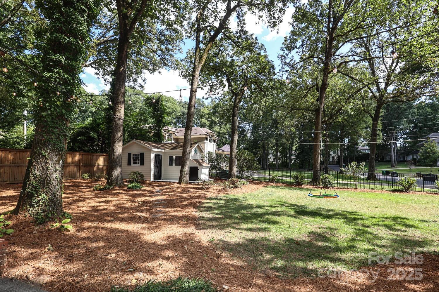 500 Ellsworth Road Charlotte, NC 28211 - Photo 36 of 40 a swimming pool with outdoor seating and yard