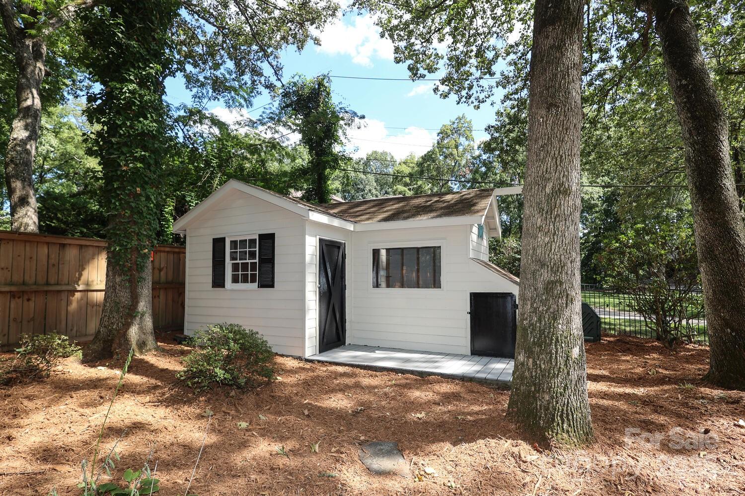 500 Ellsworth Road Charlotte, NC 28211 - Photo 37 of 40 a front view of a house with a yard and garage
