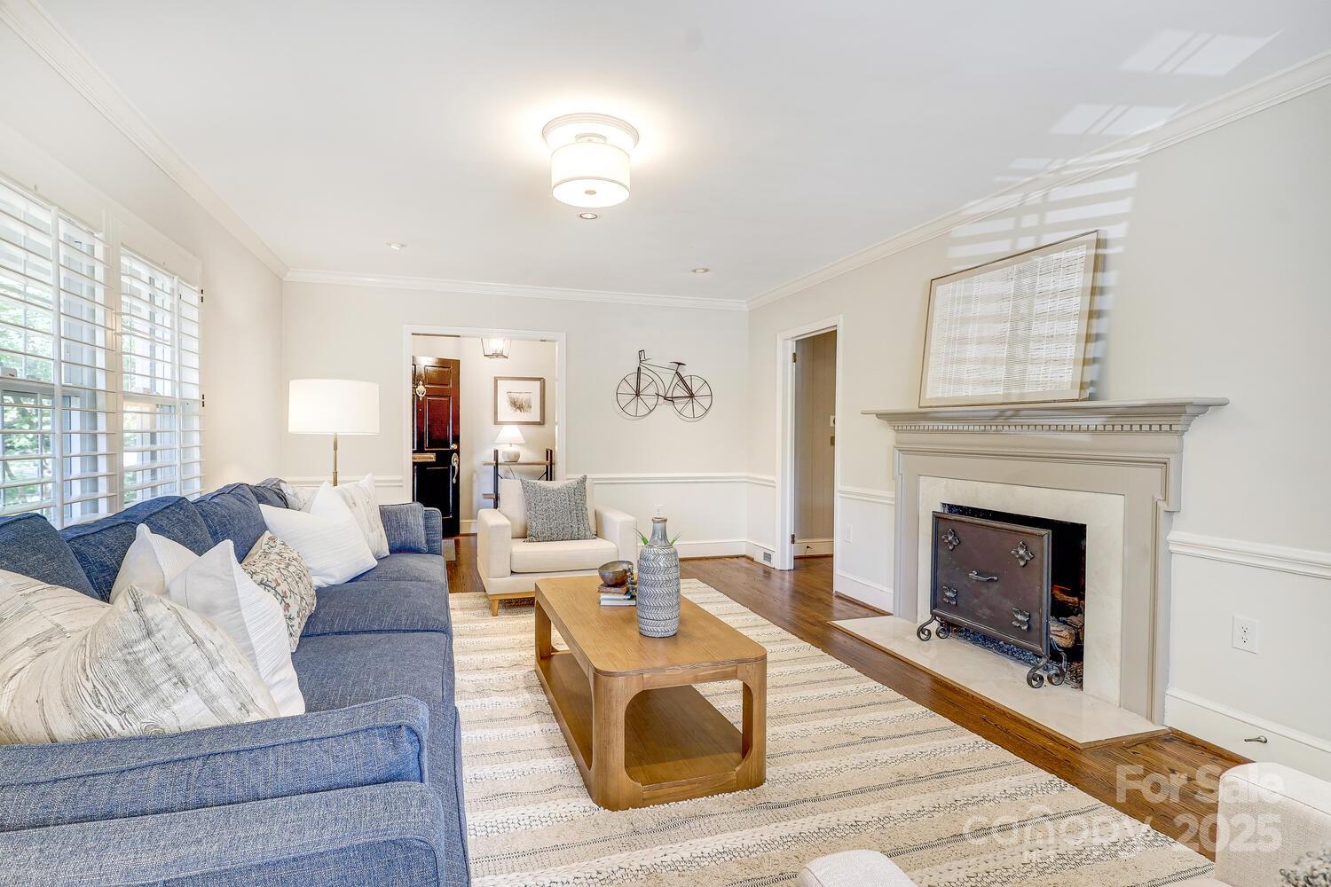 500 Ellsworth Road Charlotte, NC 28211 - Photo 7 of 40 a living room with furniture and a fireplace