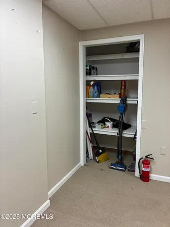 an empty room with furniture and windows
