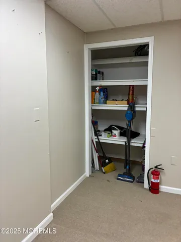 an empty room with furniture and windows