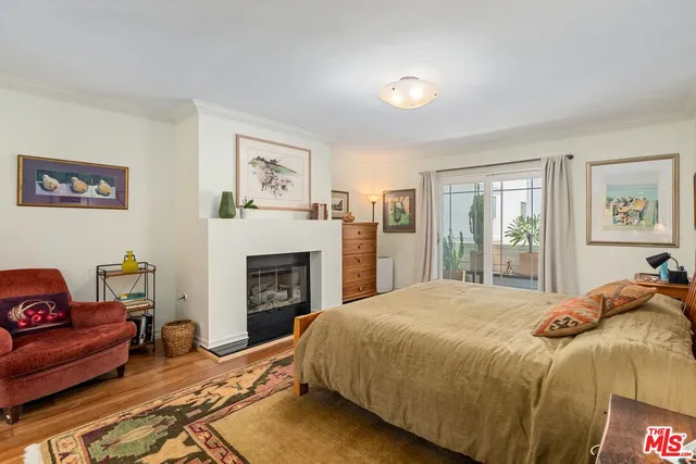 a spacious bedroom with a bed and a couch