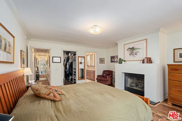 a bed room with a bed and a fireplace