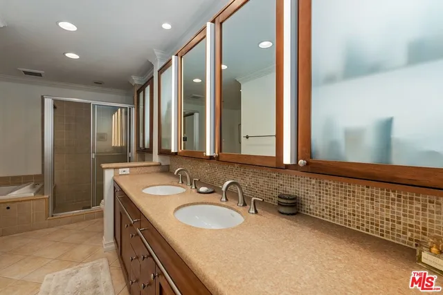 a bathroom with a sink double vanity and a mirror
