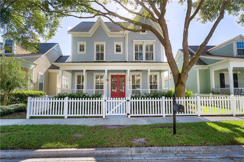 827 Spring Park Loop Celebration, FL 34747 - Photo 1 of 1 a front view of a house with a garden