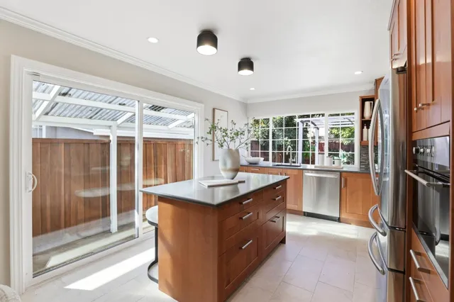 a view of a house with backyard porch and sitting area
