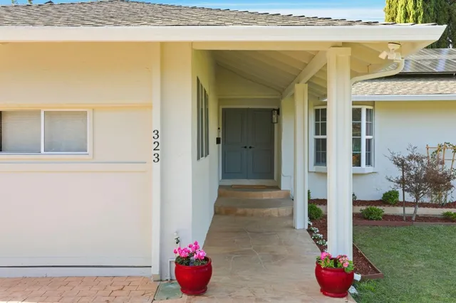 a bathroom with a sink and a shower curtain