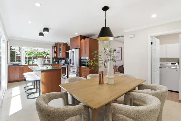 a dining room with furniture and window