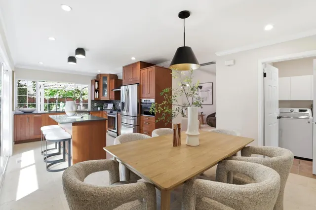 a bedroom with a bed and a large mirror