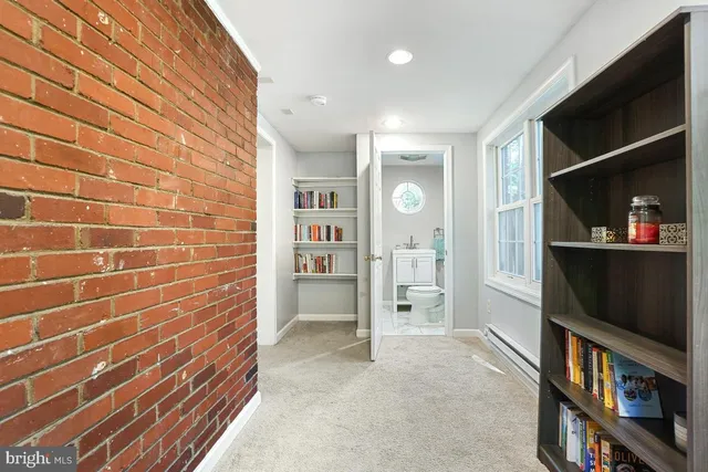 a view of livingroom with furniture and bookshelf