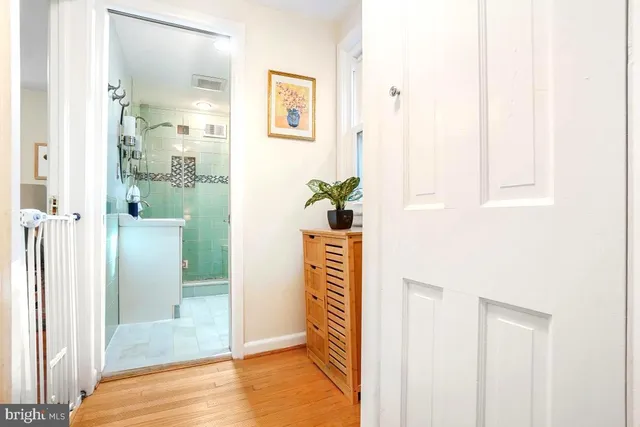 a view of a bathroom from a hallway