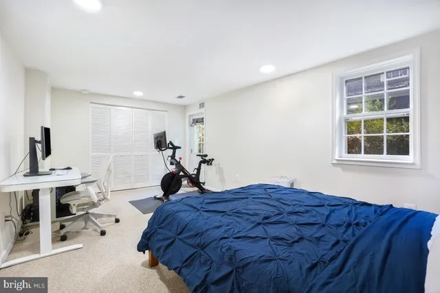 a bed room with a bed and a window