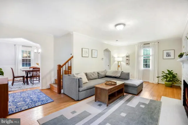 a living room with furniture rug and window