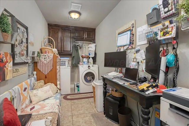a view of a workspace with furniture and a couch