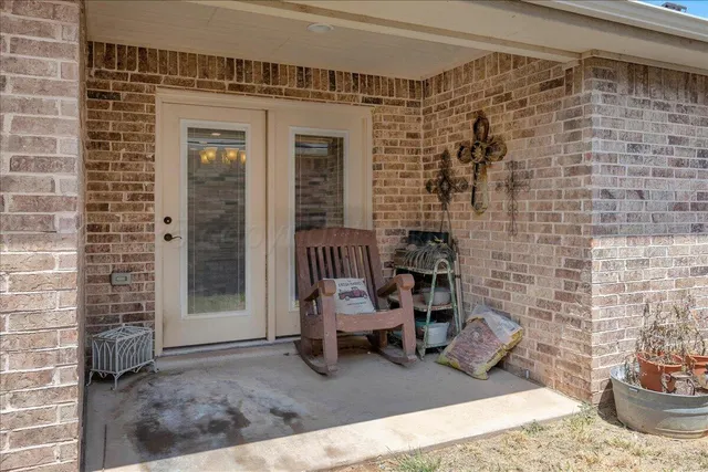a view of a patio with chair and tables
