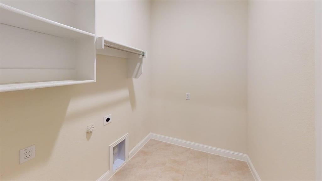 3314 Willena Road Melissa, TX 75454 - Photo 21 of 24 Built-in shelving, hanging rod, and tile flooring
