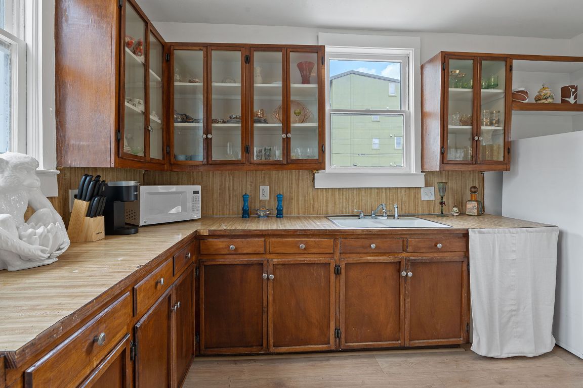 810 East 13th Street Austin, TX 78702 - Photo 15 of 39 a kitchen with stainless steel appliances granite countertop a sink and a stove