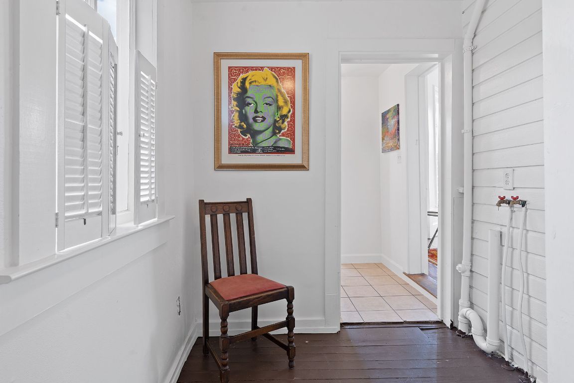 810 East 13th Street Austin, TX 78702 - Photo 16 of 39 a view of a hallway with wooden floor and a workspace