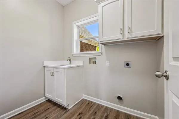 a bathroom with a sink and a window