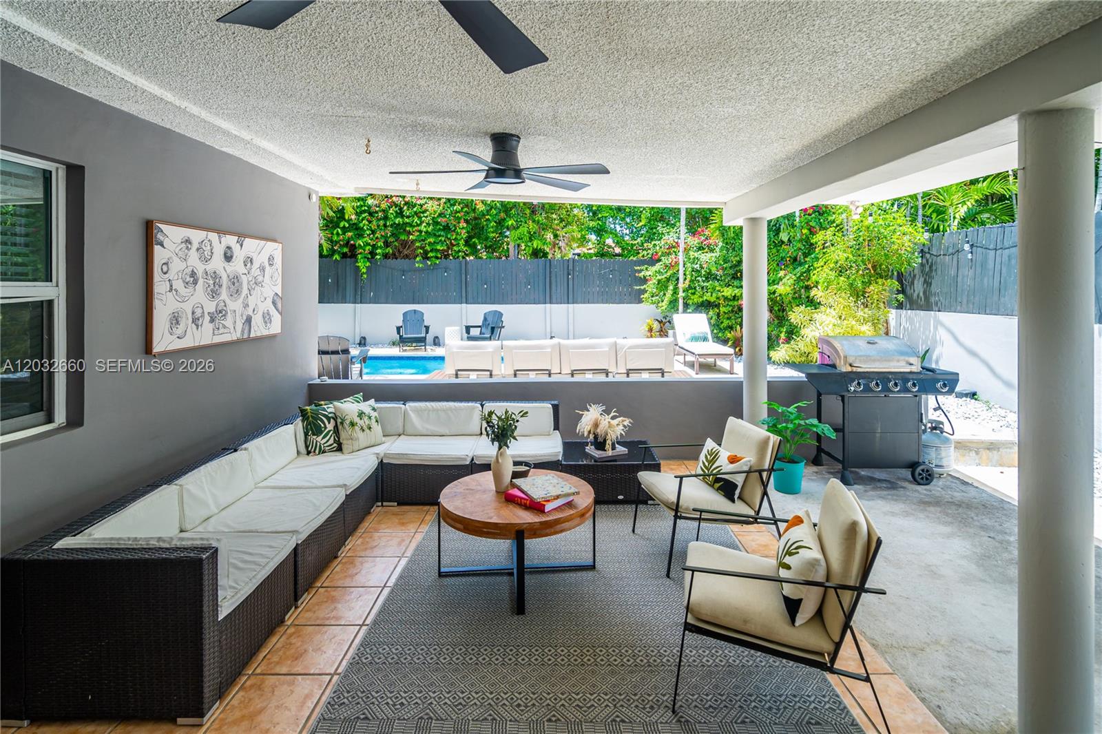 520 Southwest 22nd Road Miami, FL 33129 - Photo 23 of 76 a outdoor kitchen with a table and chairs