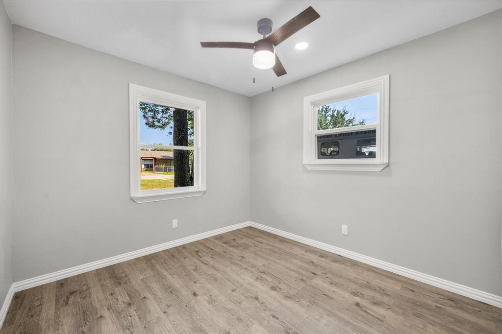 445 Canal Street Quinlan, TX 75474 - Photo 15 of 23 a view of empty room with wooden floor