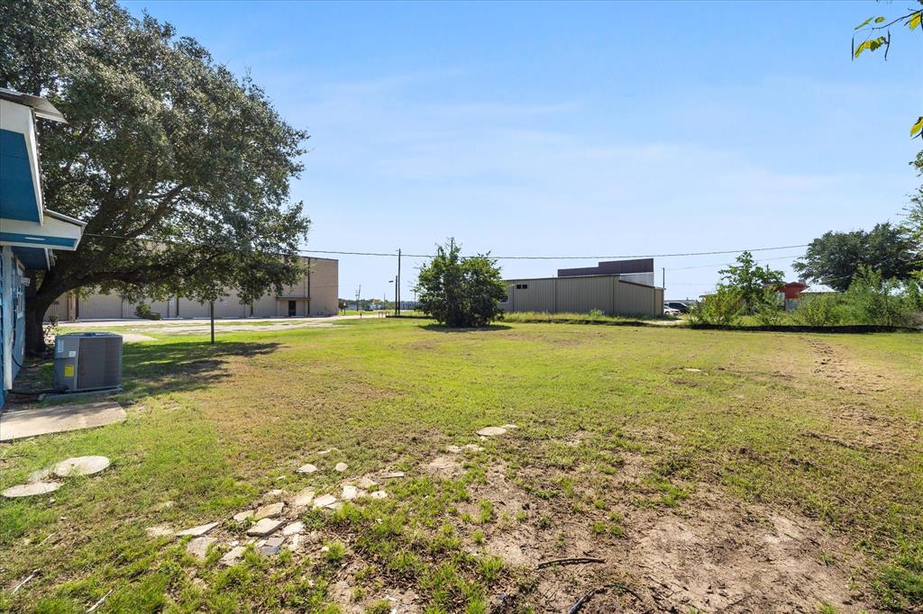 445 Canal Street Quinlan, TX 75474 - Photo 20 of 23 a view of a swimming pool with an outdoor space and seating area