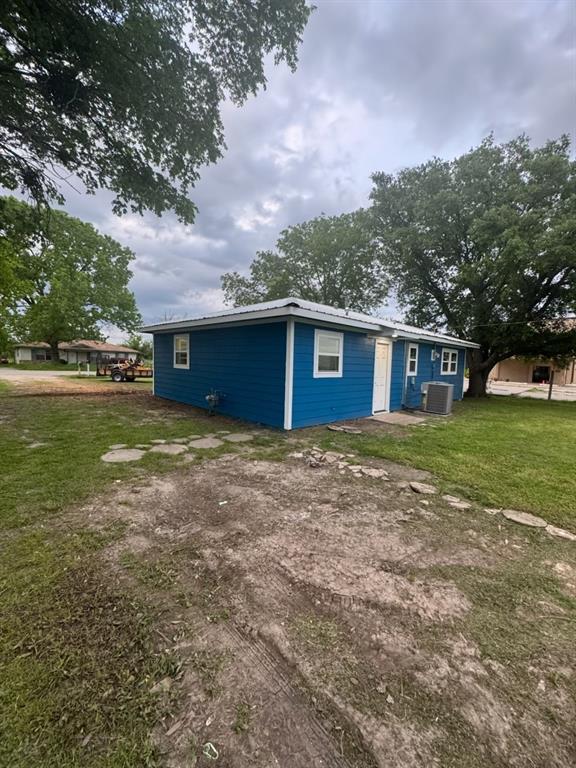 445 Canal Street Quinlan, TX 75474 - Photo 22 of 23 a view of a house with a yard