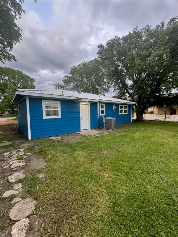 445 Canal Street Quinlan, TX 75474 - Photo 23 of 23 a view of a house with a backyard