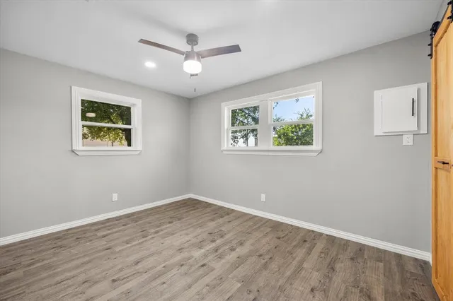 a view of room with window and ceiling fan