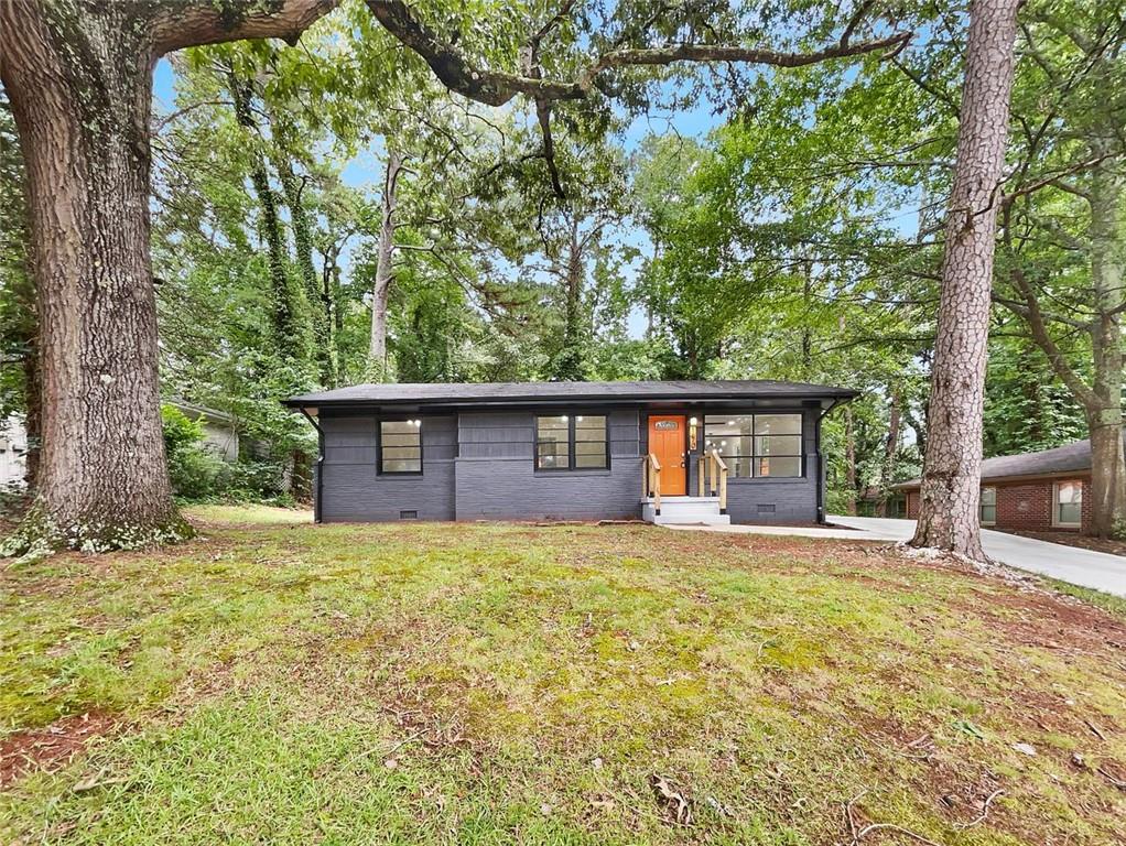 1670 San Gabriel Avenue Decatur, GA 30032 - Photo 1 of 1 a house with trees in the background