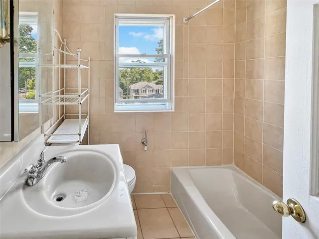 a bathroom with a sink and a bathtub