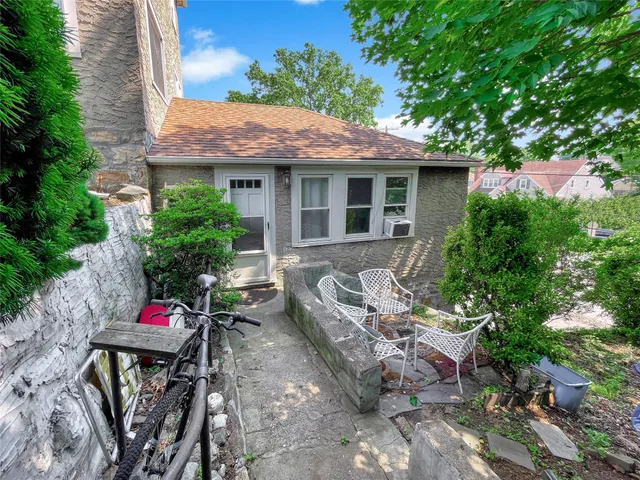 an outdoor space with lounge chair