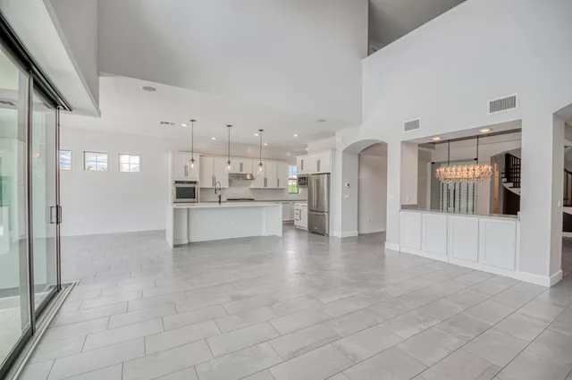a bathroom with a toilet a sink a mirror a bathtub and vanity