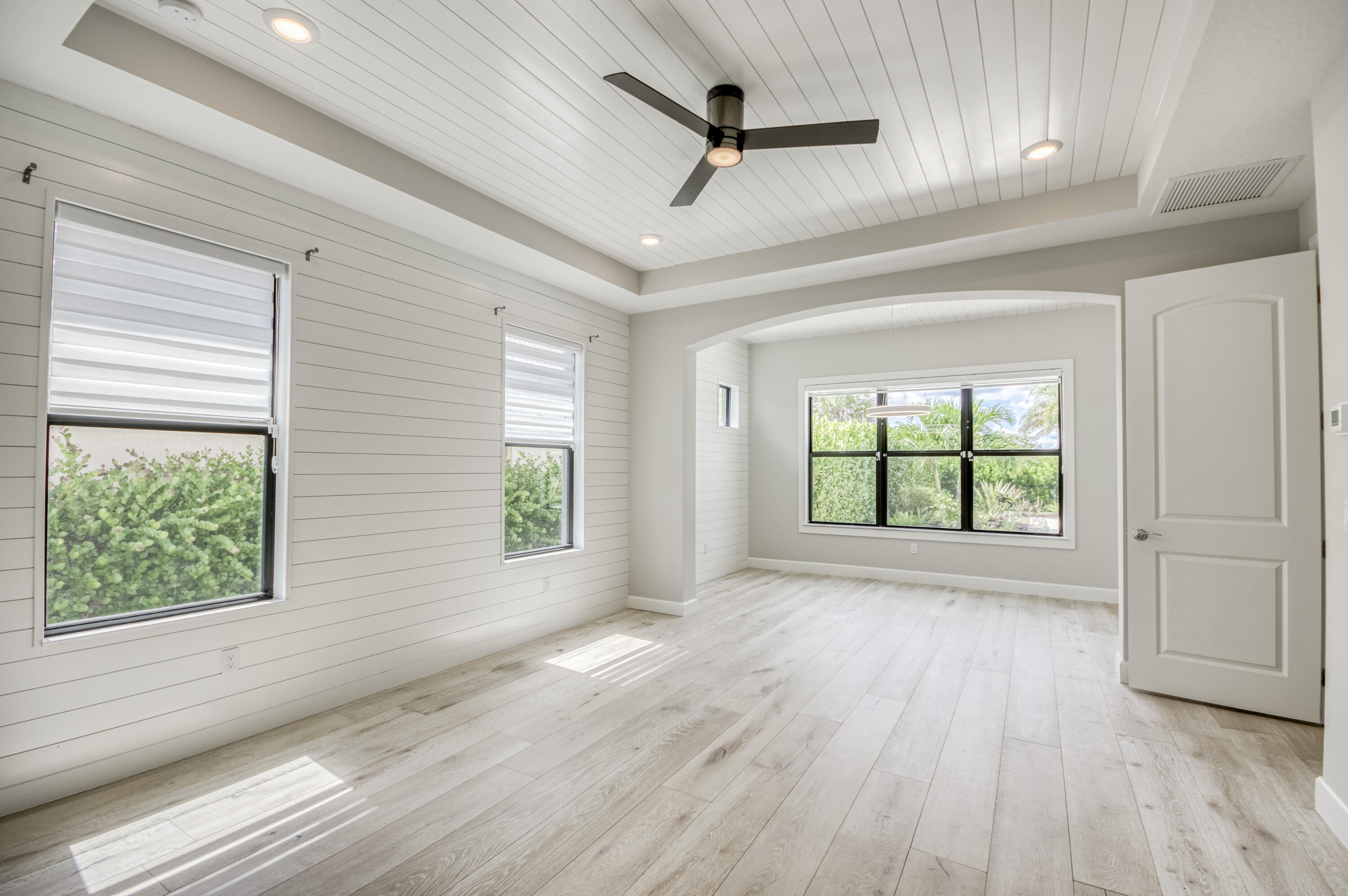 102 Cerulean Key Way Jupiter, FL 33478 - Photo 24 of 85 a view of empty room with wooden floor and fan