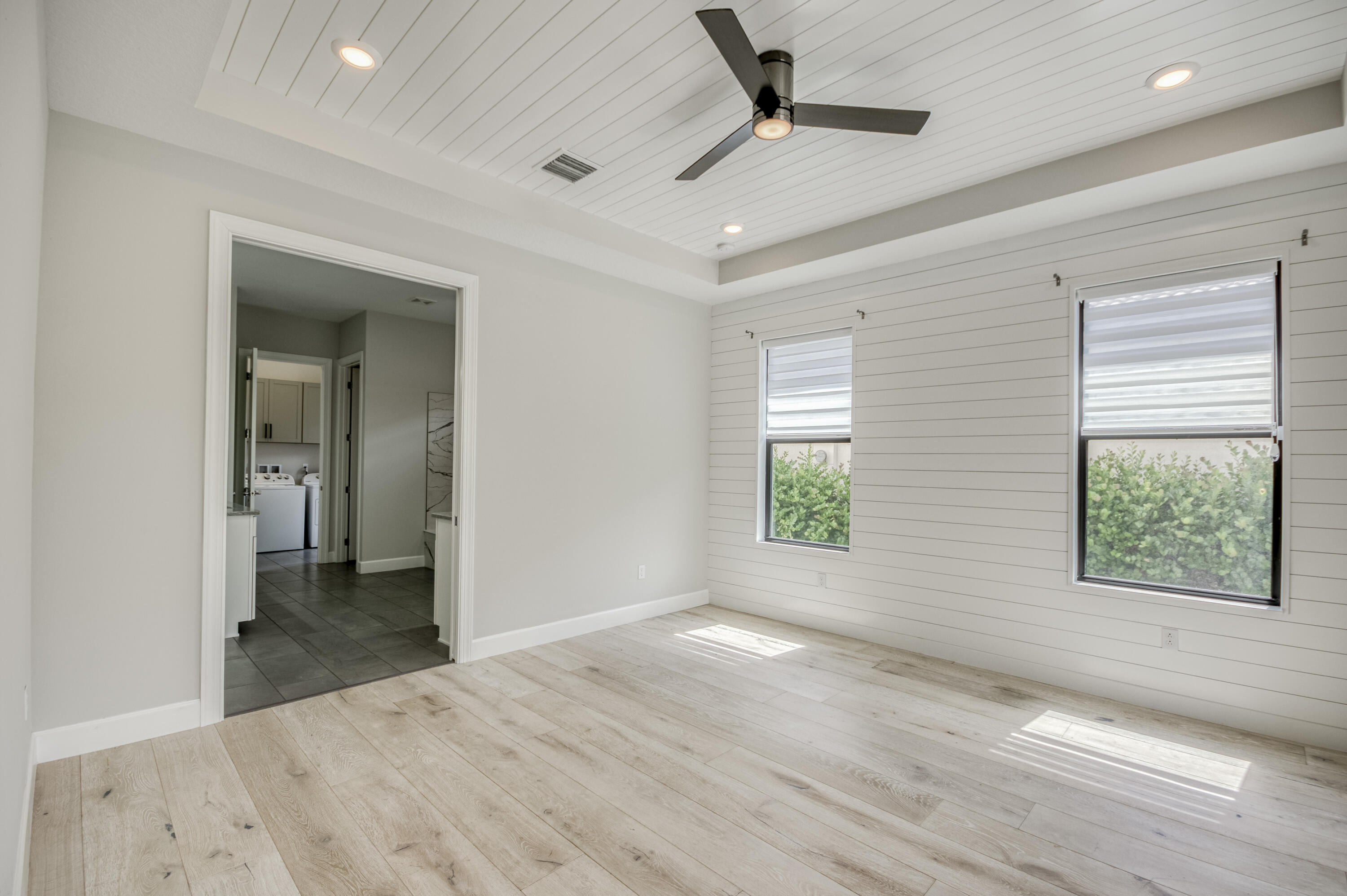 102 Cerulean Key Way Jupiter, FL 33478 - Photo 26 of 85 en empty room with windows and a ceiling fan