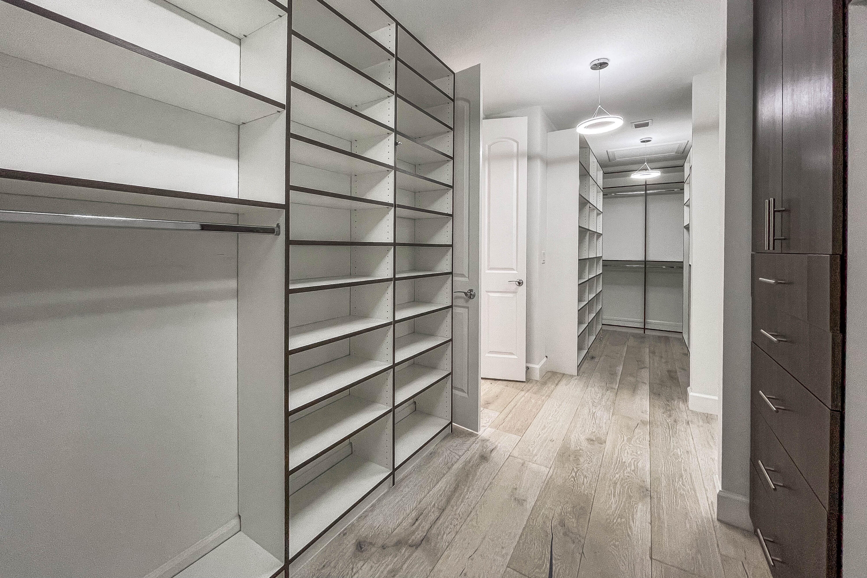 102 Cerulean Key Way Jupiter, FL 33478 - Photo 27 of 85 a view of walk in closet with empty racks