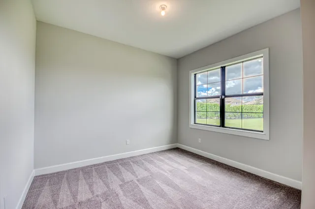 a view of a green field with clear sky