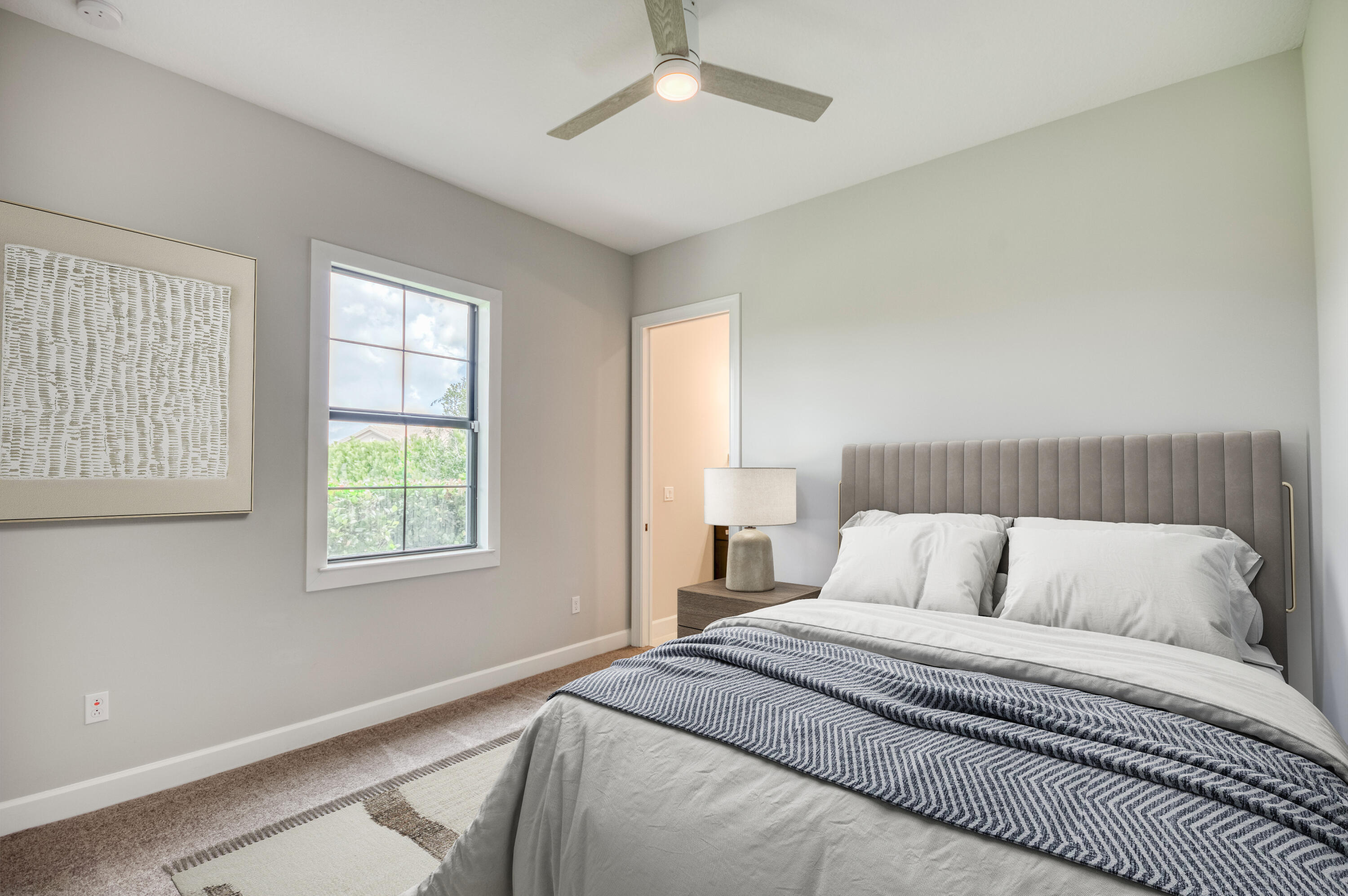 102 Cerulean Key Way Jupiter, FL 33478 - Photo 35 of 85 a bedroom with a bed and a window