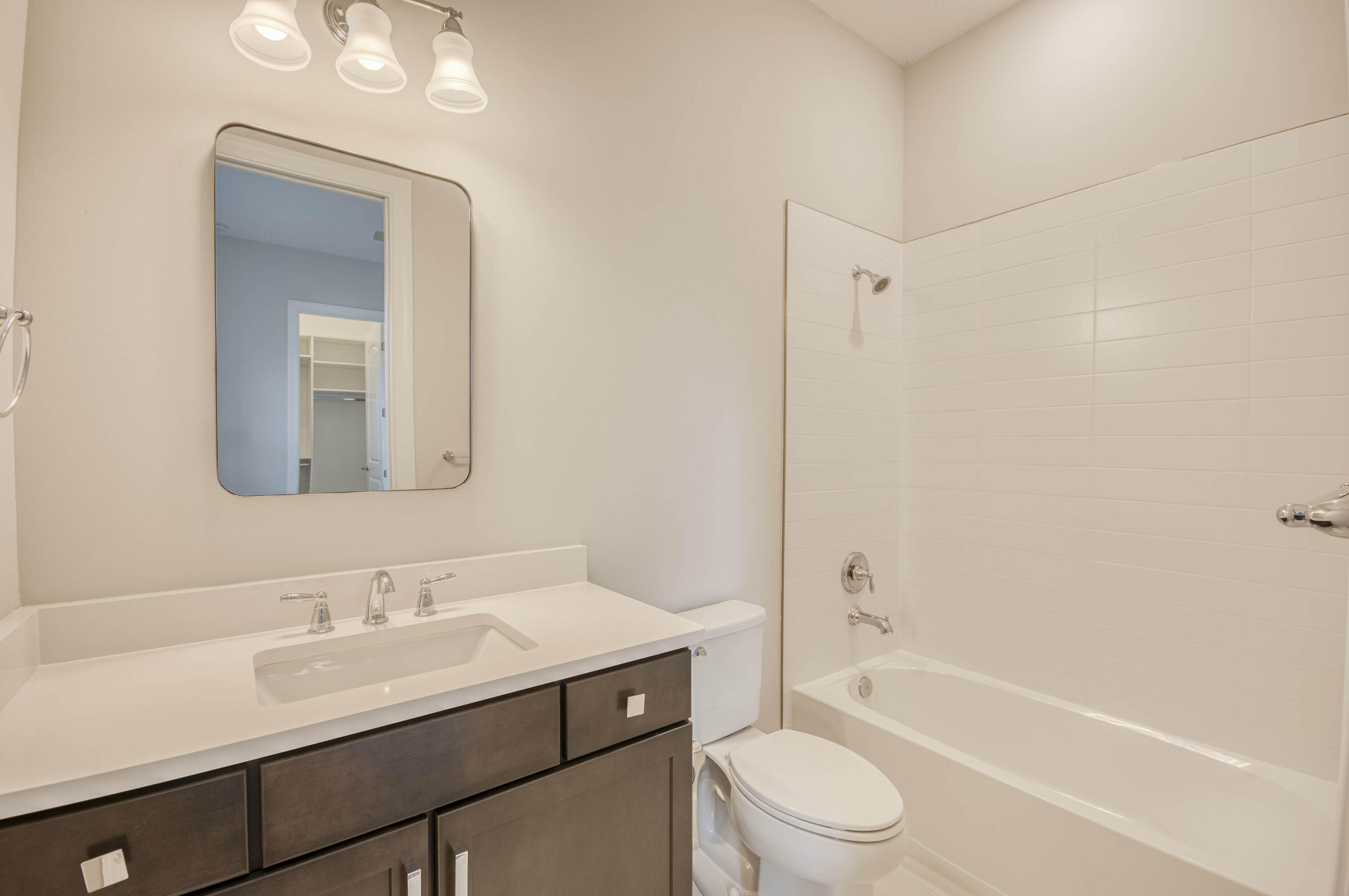 102 Cerulean Key Way Jupiter, FL 33478 - Photo 37 of 85 a bathroom with a toilet a sink a mirror a bathtub and vanity