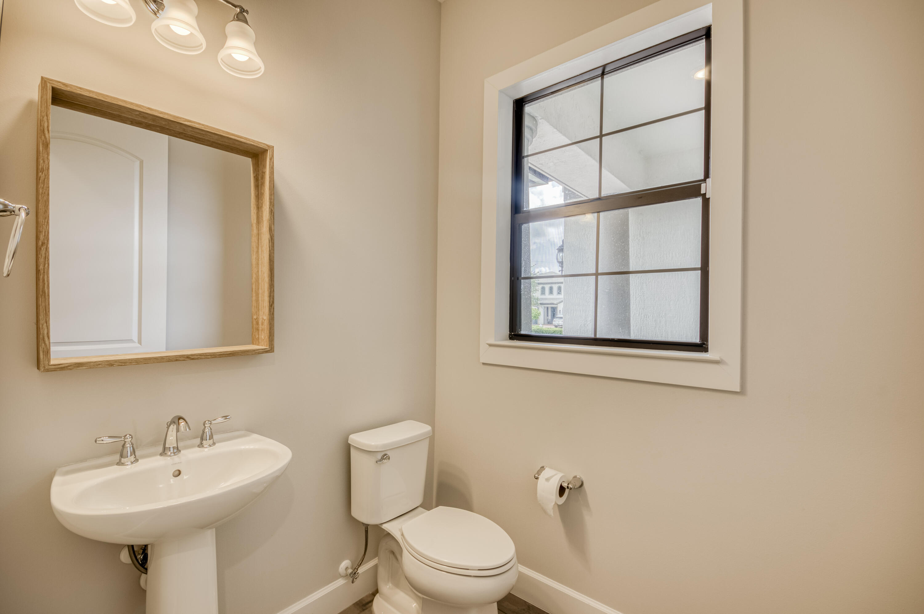102 Cerulean Key Way Jupiter, FL 33478 - Photo 39 of 85 a bathroom with a sink a mirror and a toilet