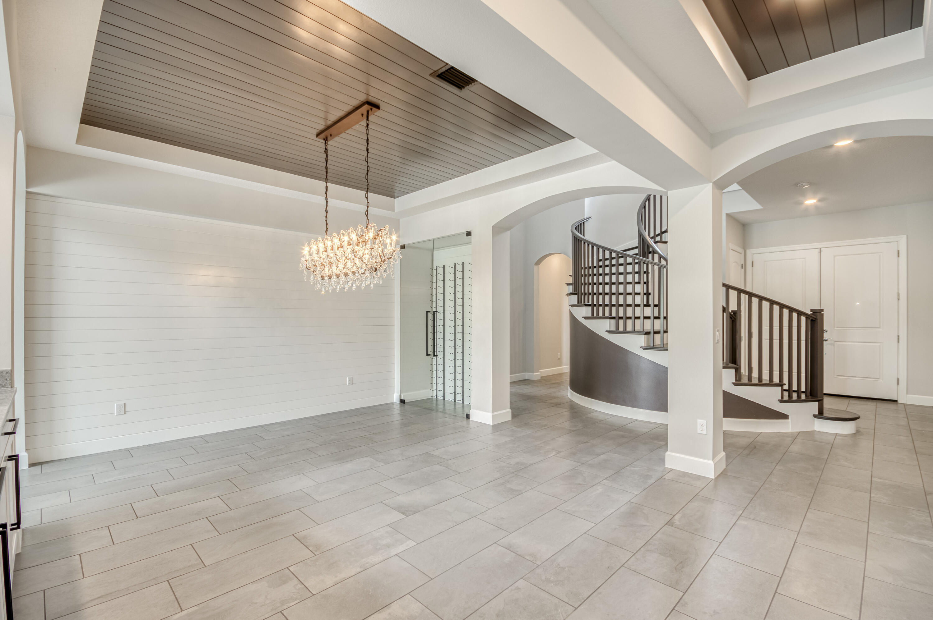 102 Cerulean Key Way Jupiter, FL 33478 - Photo 5 of 85 a view of a hallway with a chandelier