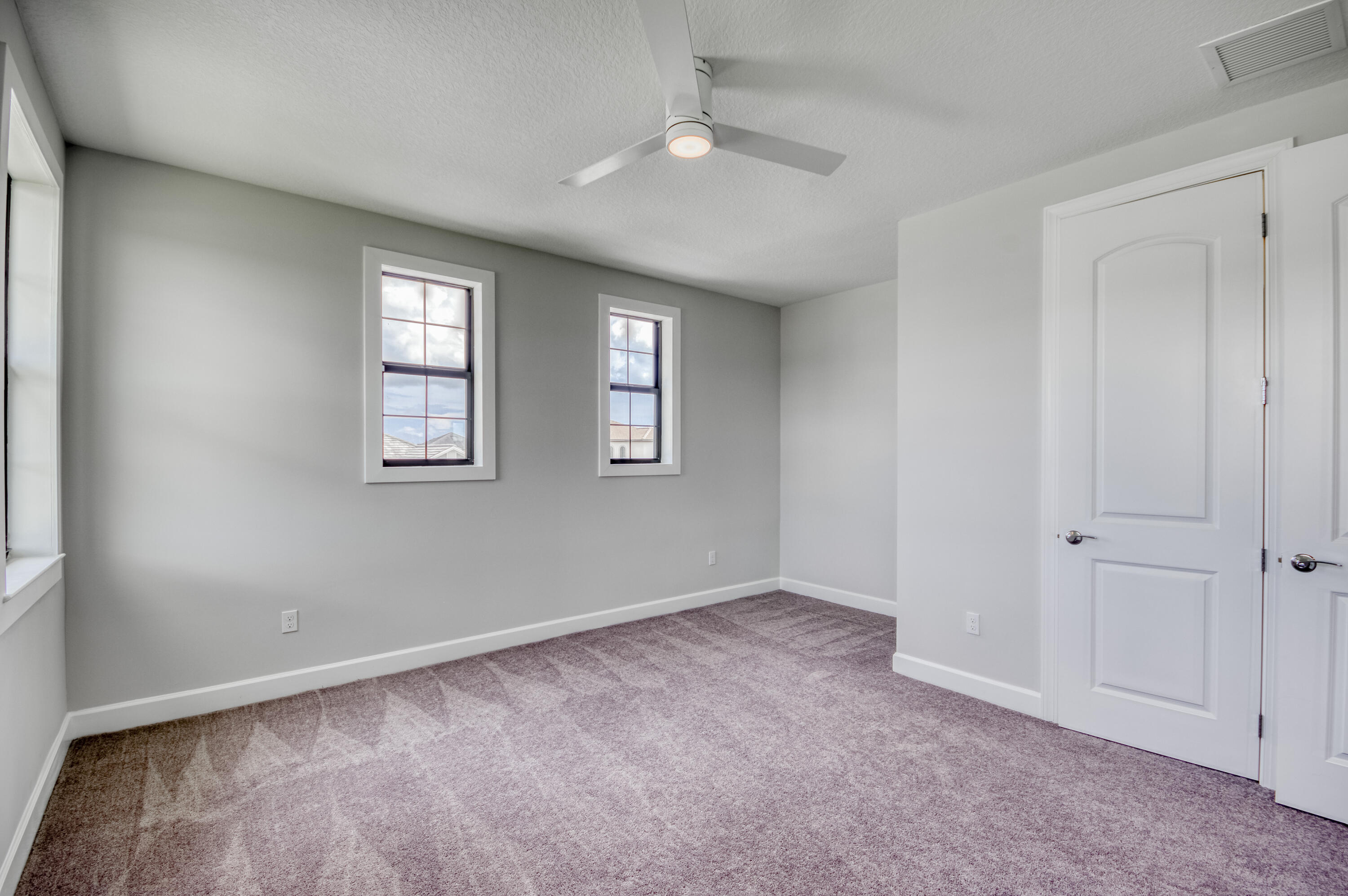 102 Cerulean Key Way Jupiter, FL 33478 - Photo 54 of 85 an empty room with windows and closet