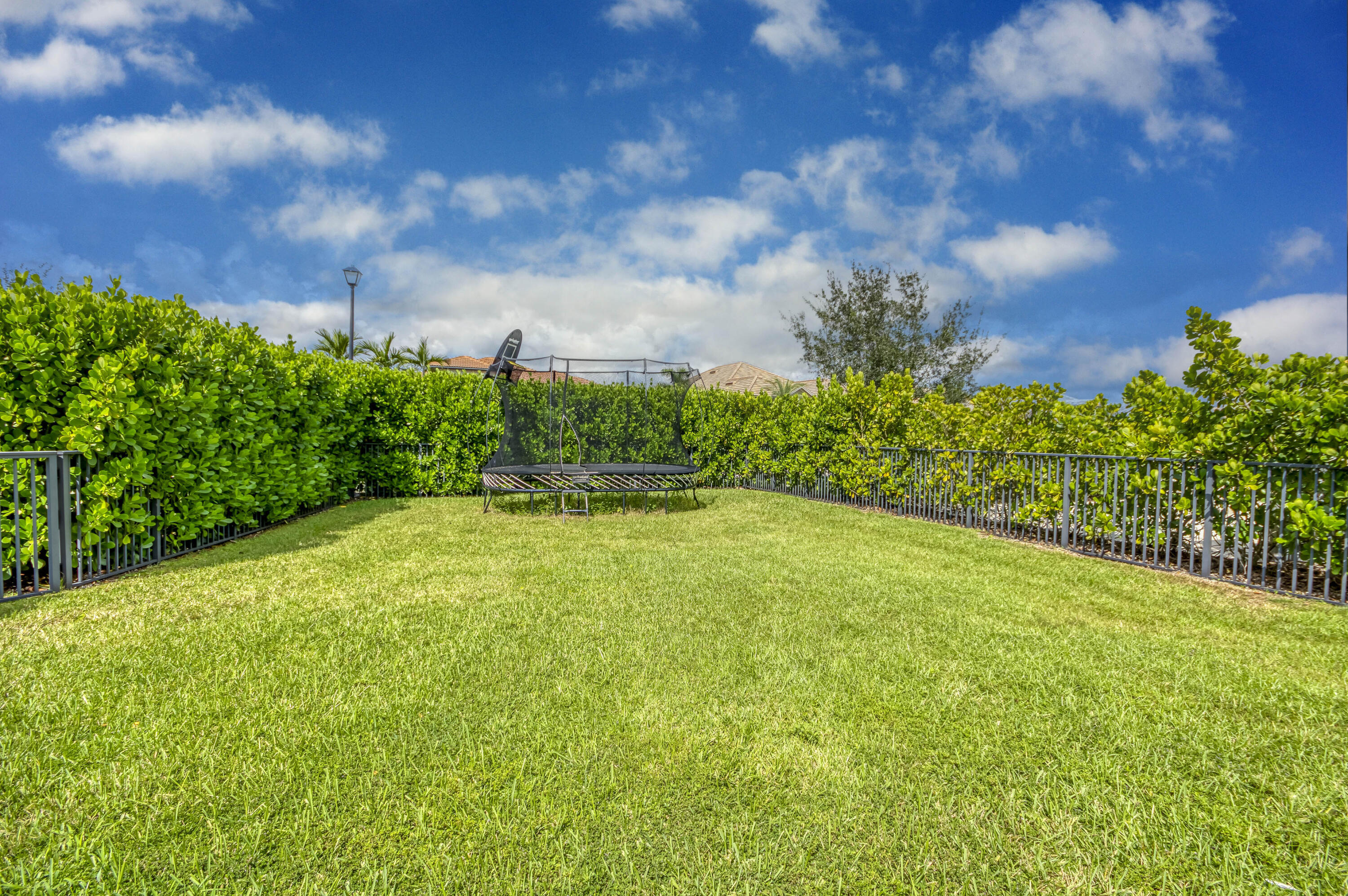 102 Cerulean Key Way Jupiter, FL 33478 - Photo 70 of 85 a view of a yard with an outdoor space