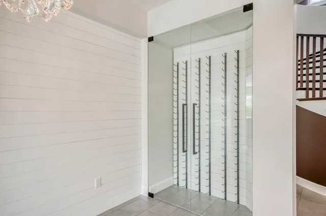 a view of a hallway with wooden shelves