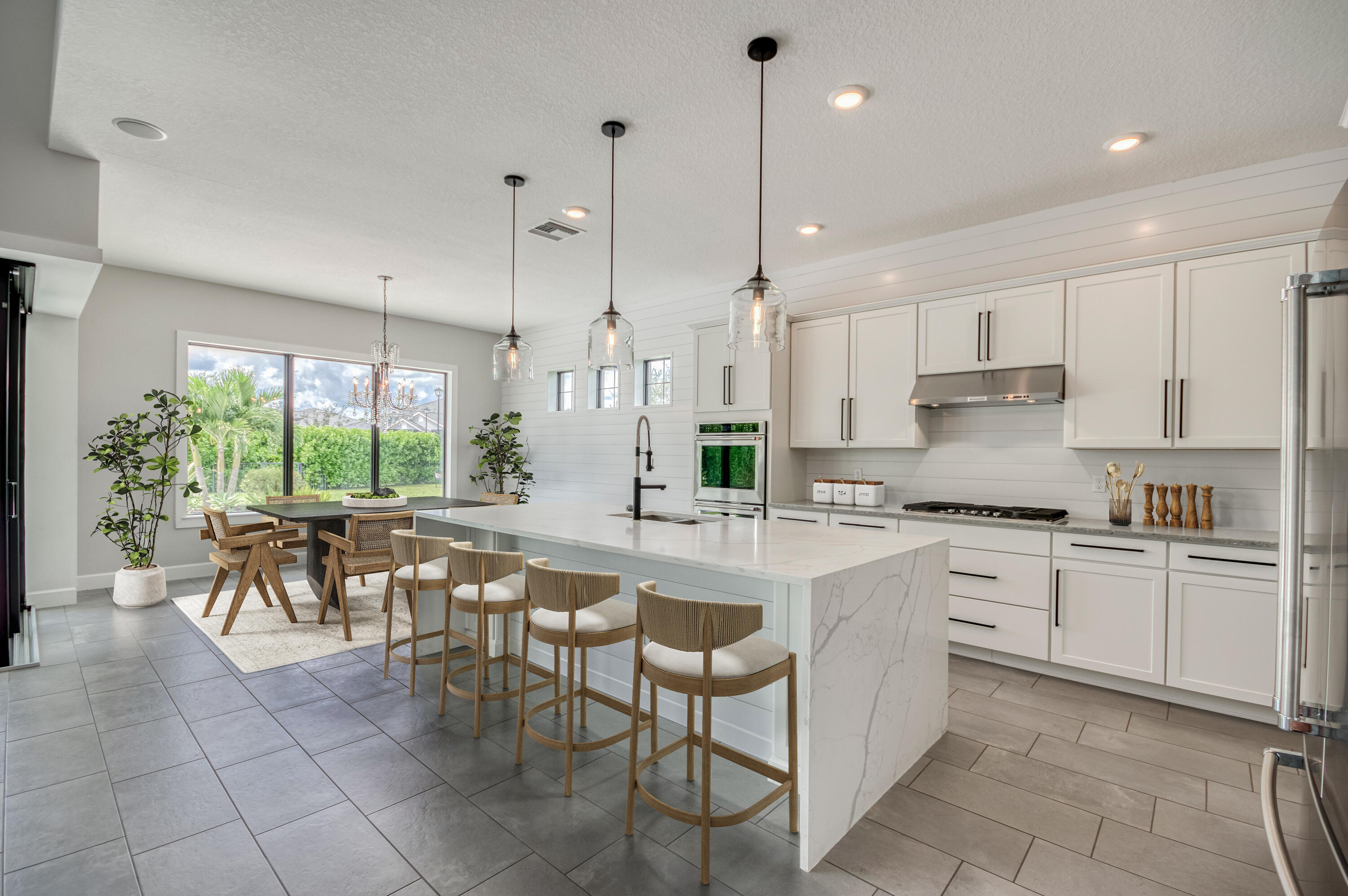 102 Cerulean Key Way Jupiter, FL 33478 - Photo 10 of 85 a kitchen with a table chairs sink and cabinets