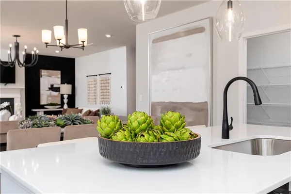 a kitchen with a sink and refrigerator